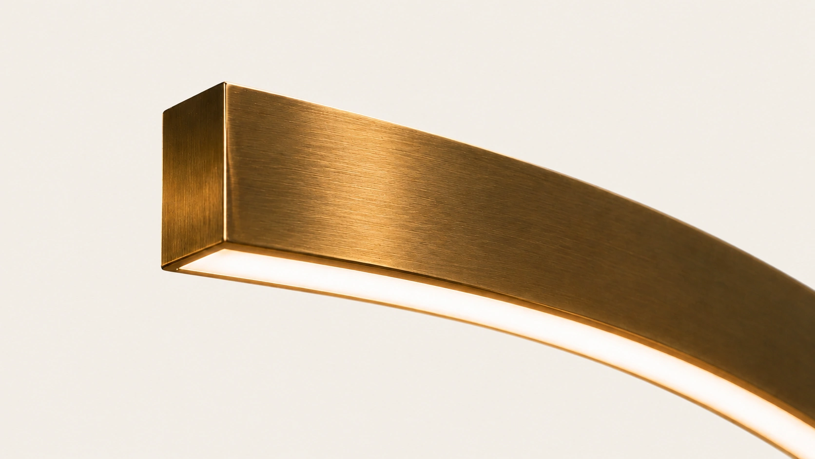 Detail of the Axis light with luminous line in brushed gold finish