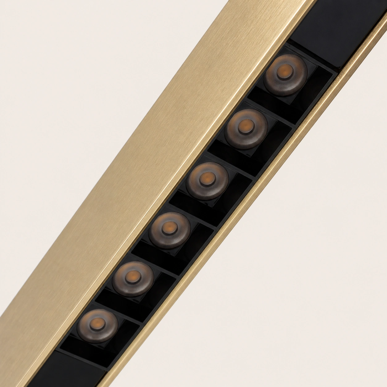 Detail of the HORIZON light with LED modules integrated into a gold linear profile