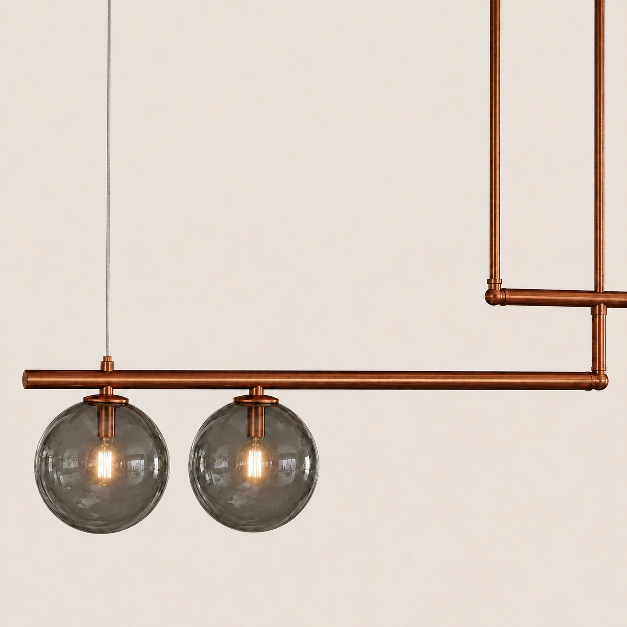 Detail of the SEGNO light with smoked glass globes and RAL 8004 finish