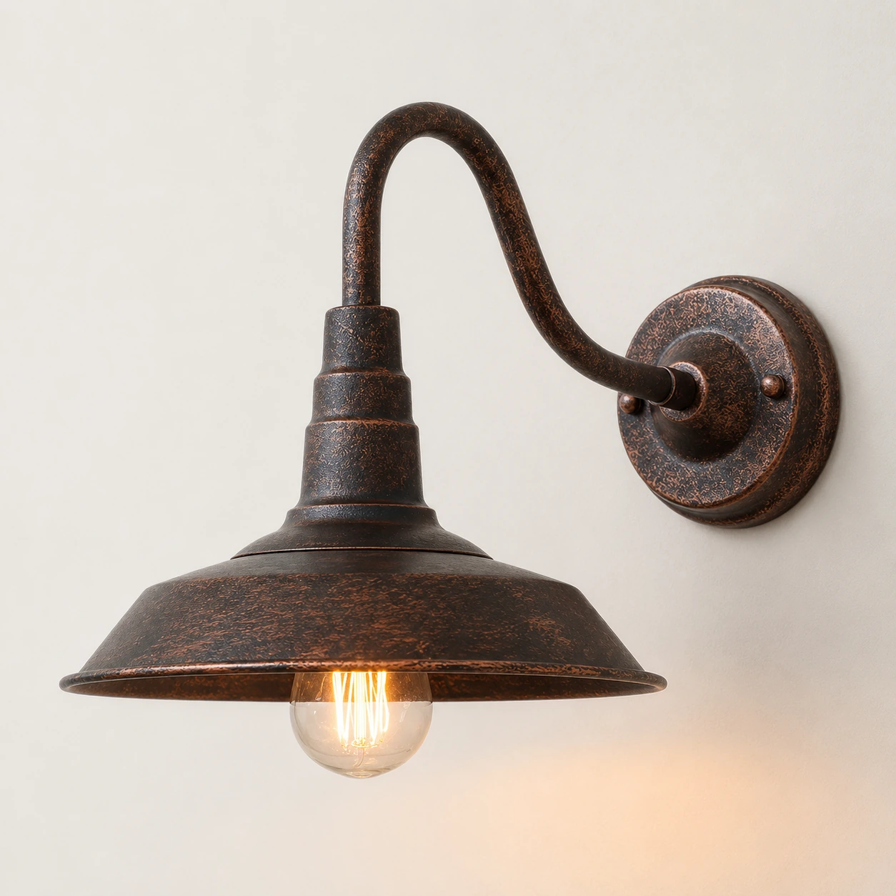 BRISTOL wall light with curved arm and aged copper finish