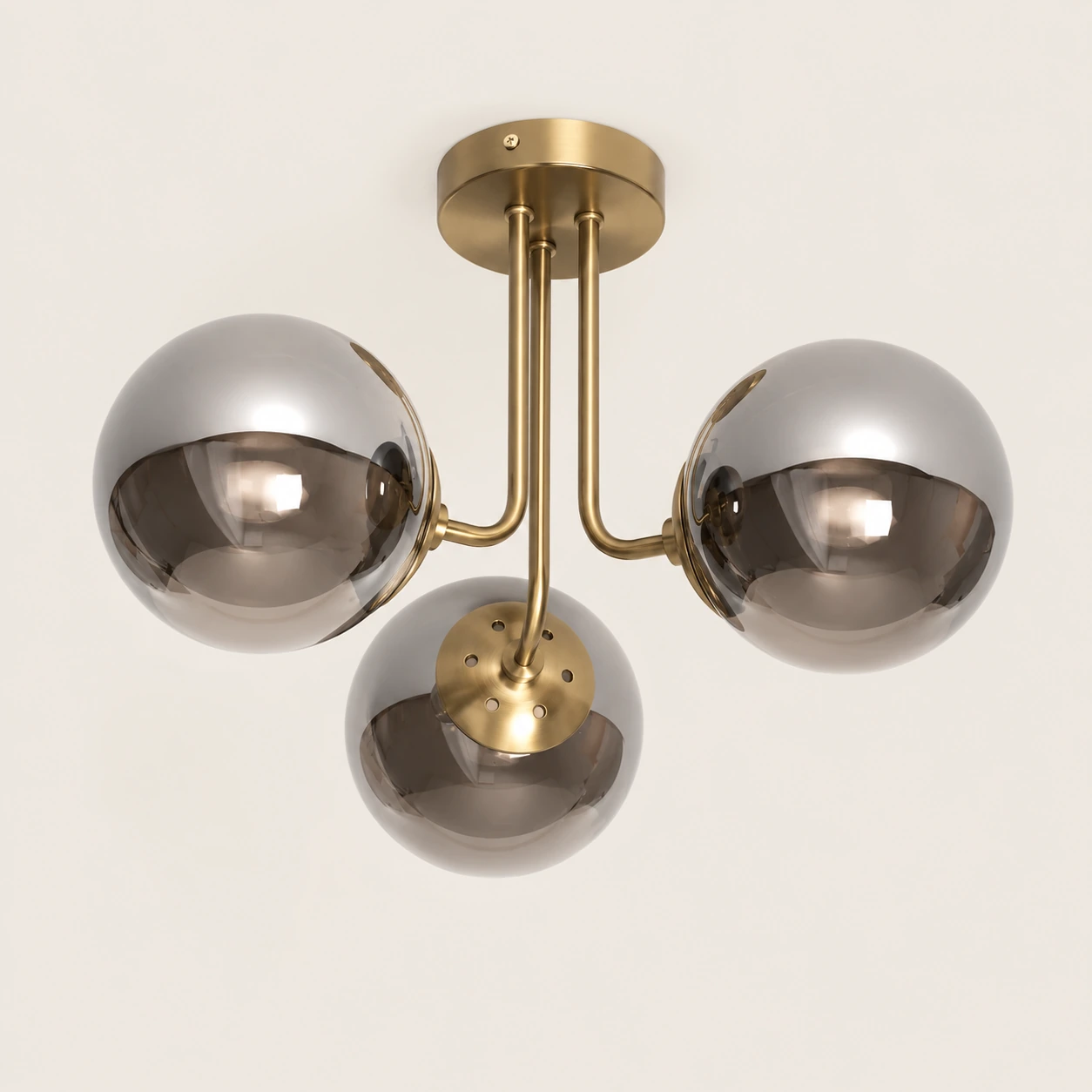 AERIS ceiling light with matte gold structure and smoked glass globes